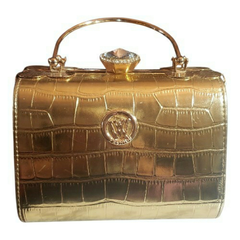 Elegant gold crocodile-embossed handbag shine with sophistication.